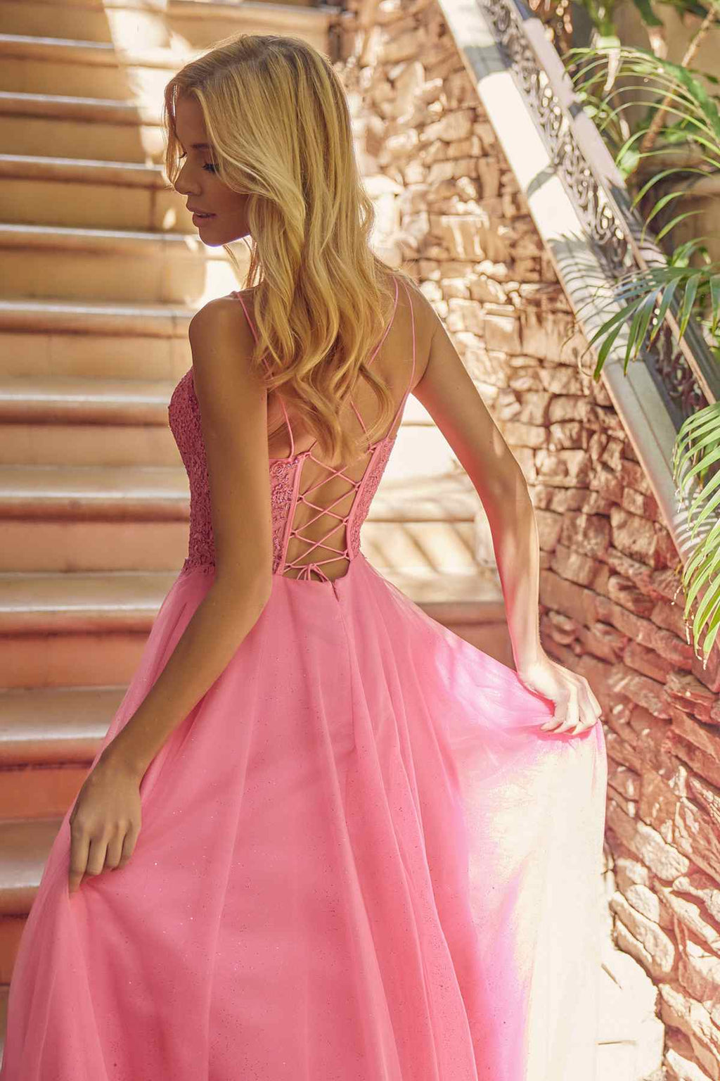 Fuchsia pink sparkle tulle ball gown with crisscross open-back straps and full skirt