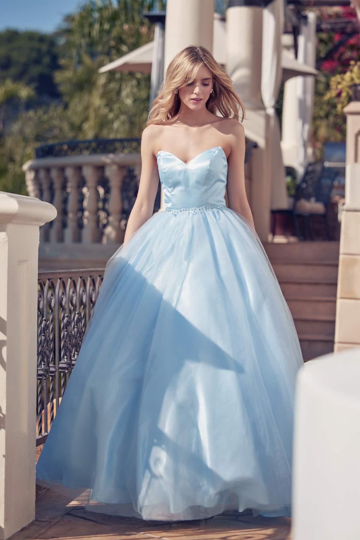 Light blue strapless A-line ball gown with beaded waist belt, full tulle skirt