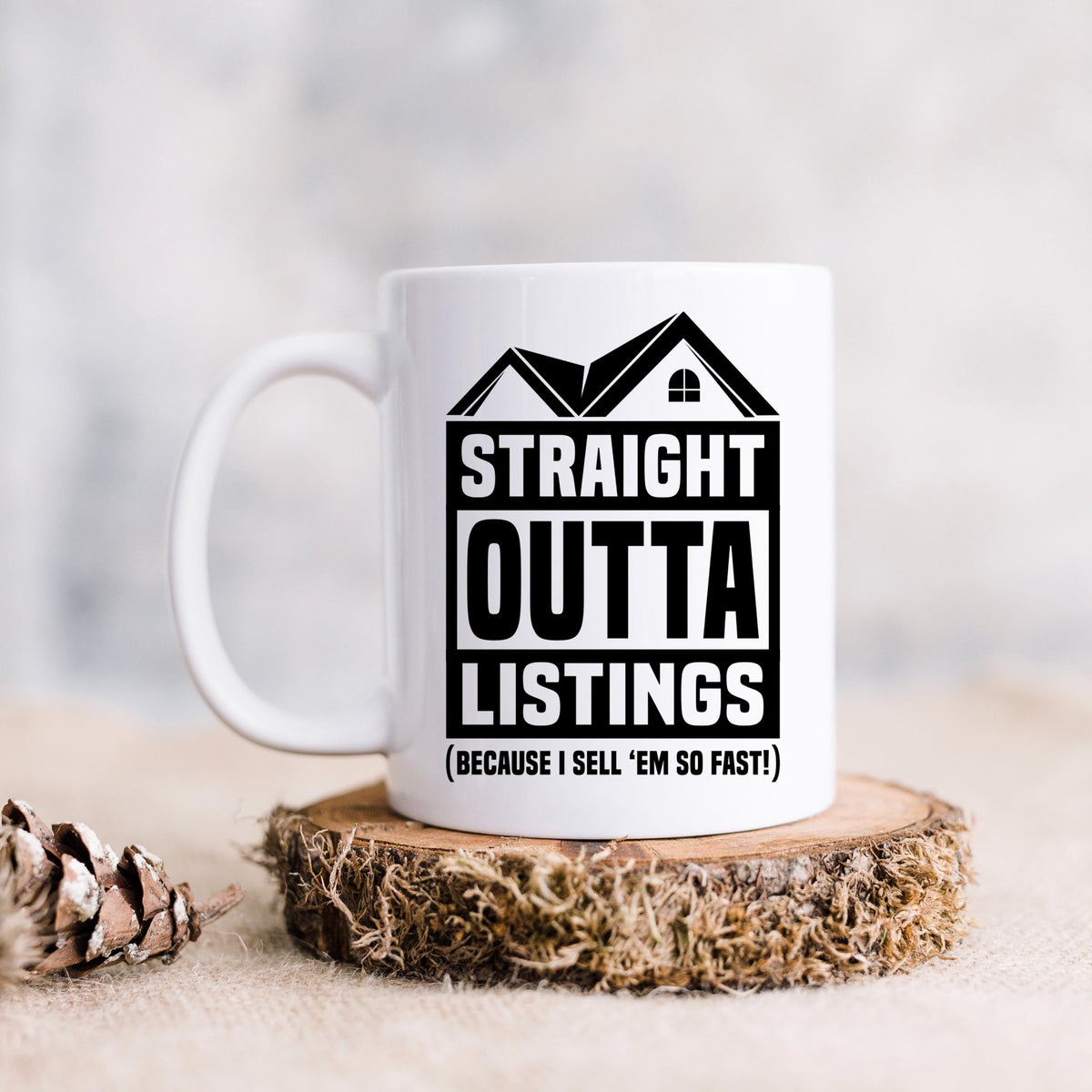 White ceramic mug with black “STRAIGHT OUTTA LISTINGS” house graphic