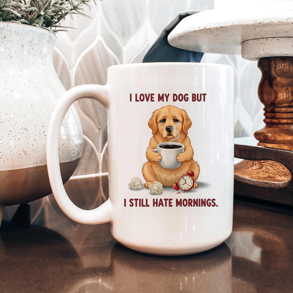 White ceramic dog lover mug with dog holding coffee and red alarm clock; text: I still hate mornings.