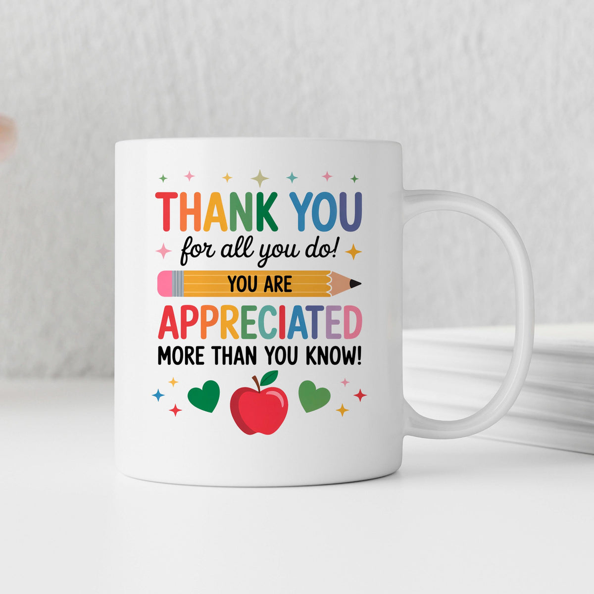 White ceramic thank-you mug with “Thank You” and “You are appreciated” text and apple graphic