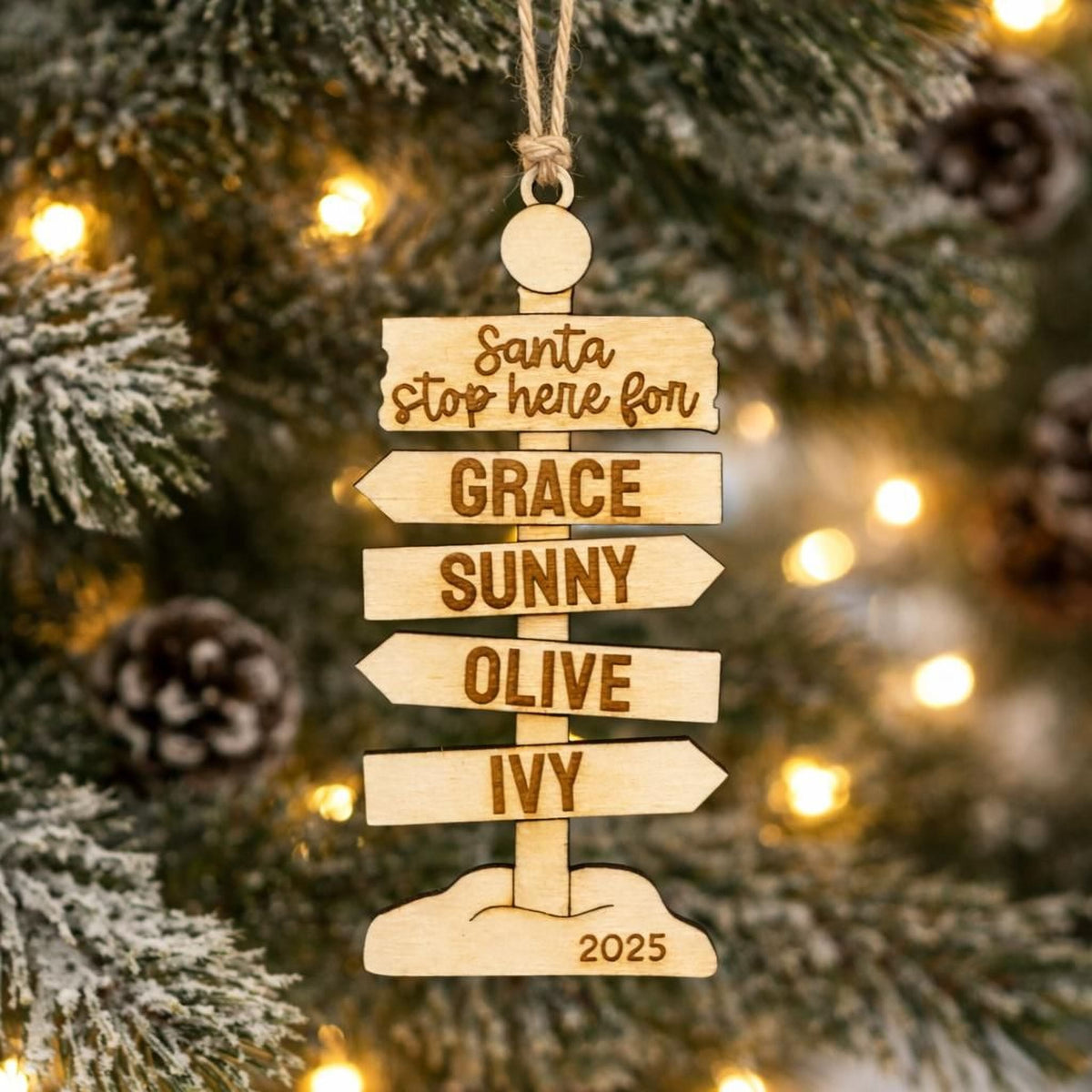 Rustic wooden family Christmas signpost ornament with engraved names and year 2025