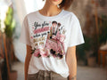 White graphic tee with 'You glow differently' text and makeup brush illustration