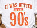 White graphic T-shirt with orange distressed text: “IT WAS BETTER IN THE 90’s”