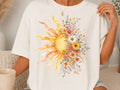 White graphic tee with large sunburst and floral bouquet print on front