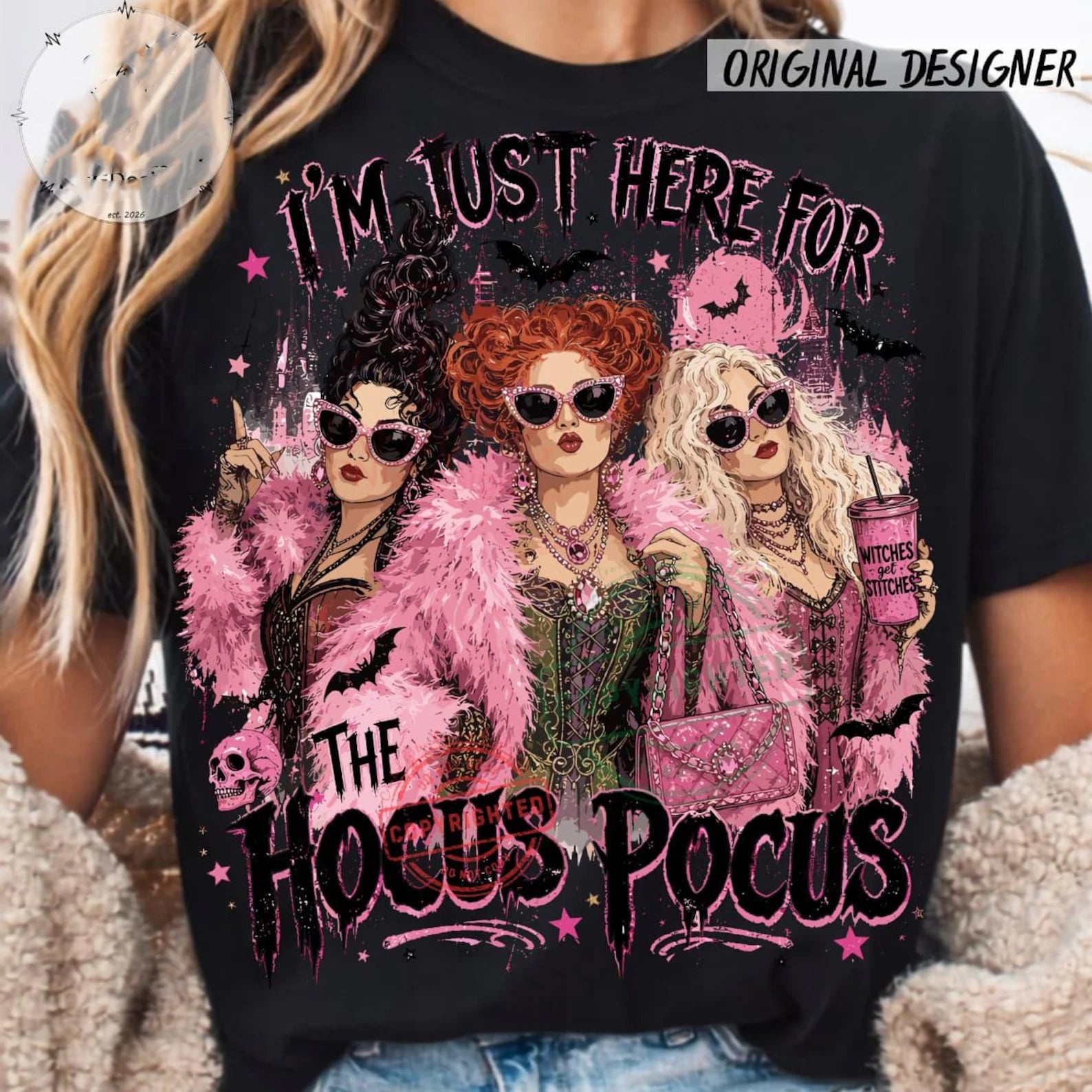 Black graphic crewneck t-shirt with three women illustration in pink feather accents