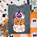 Dark gray Halloween graphic tee with stacked pumpkins, ghosts, and web design