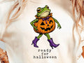 Light beige Halloween graphic tee with cartoon frog on jack-o’-lantern and “ready for halloween”