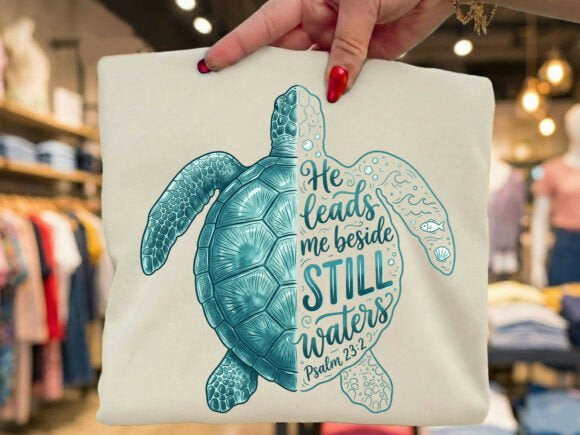 Still waters graphic tee with teal sea turtle and scripture-style lettering on light background