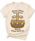 Beige graphic T-shirt with 'Bring What You Have' basket scripture print