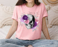 Pink floral skeleton graphic tee with purple rose skull front