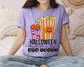 Purple Halloween graphic tee with popcorn, jack-o-lantern, and “Halloween and Chill” text