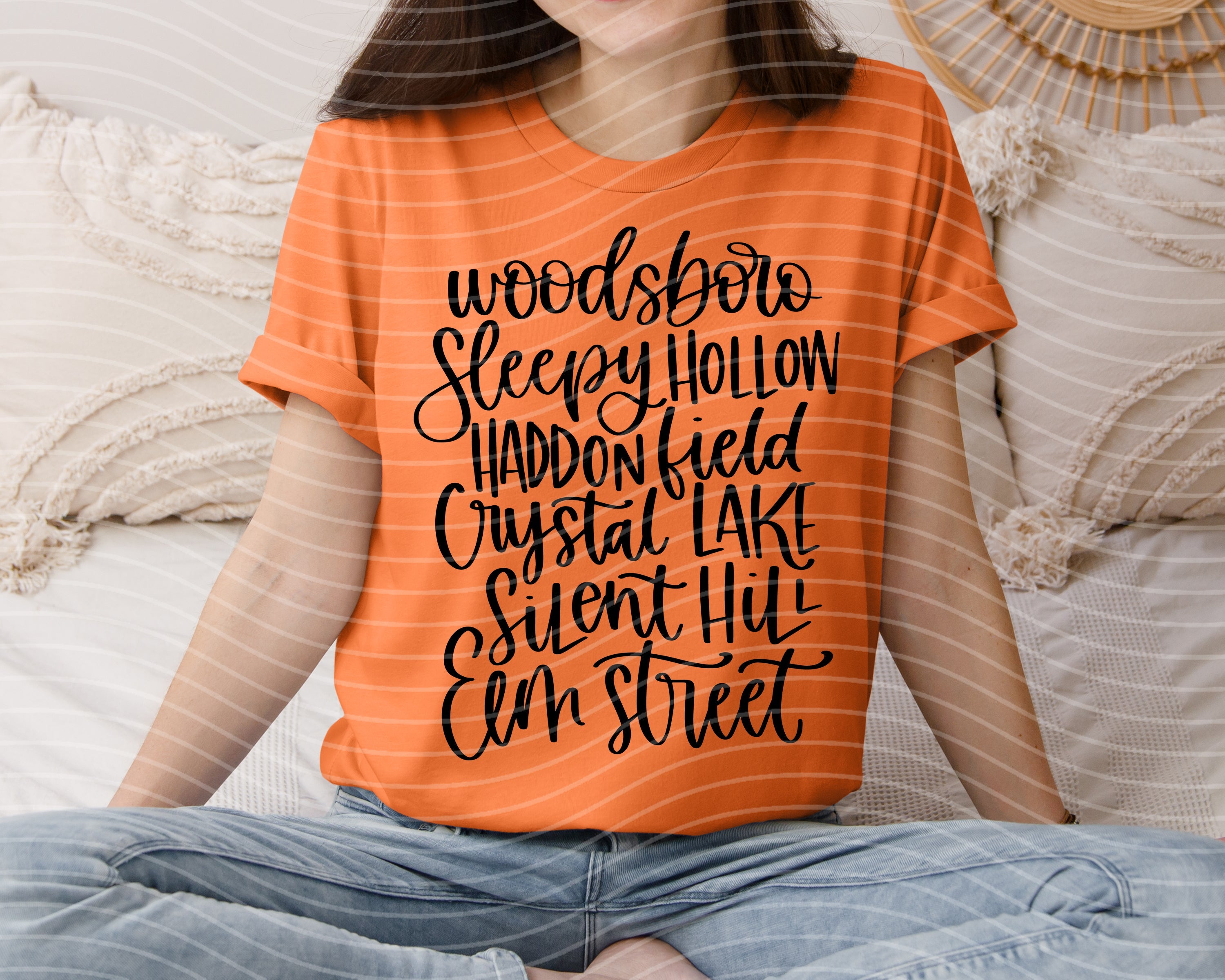 Orange graphic T-shirt with black horror town slogan front print