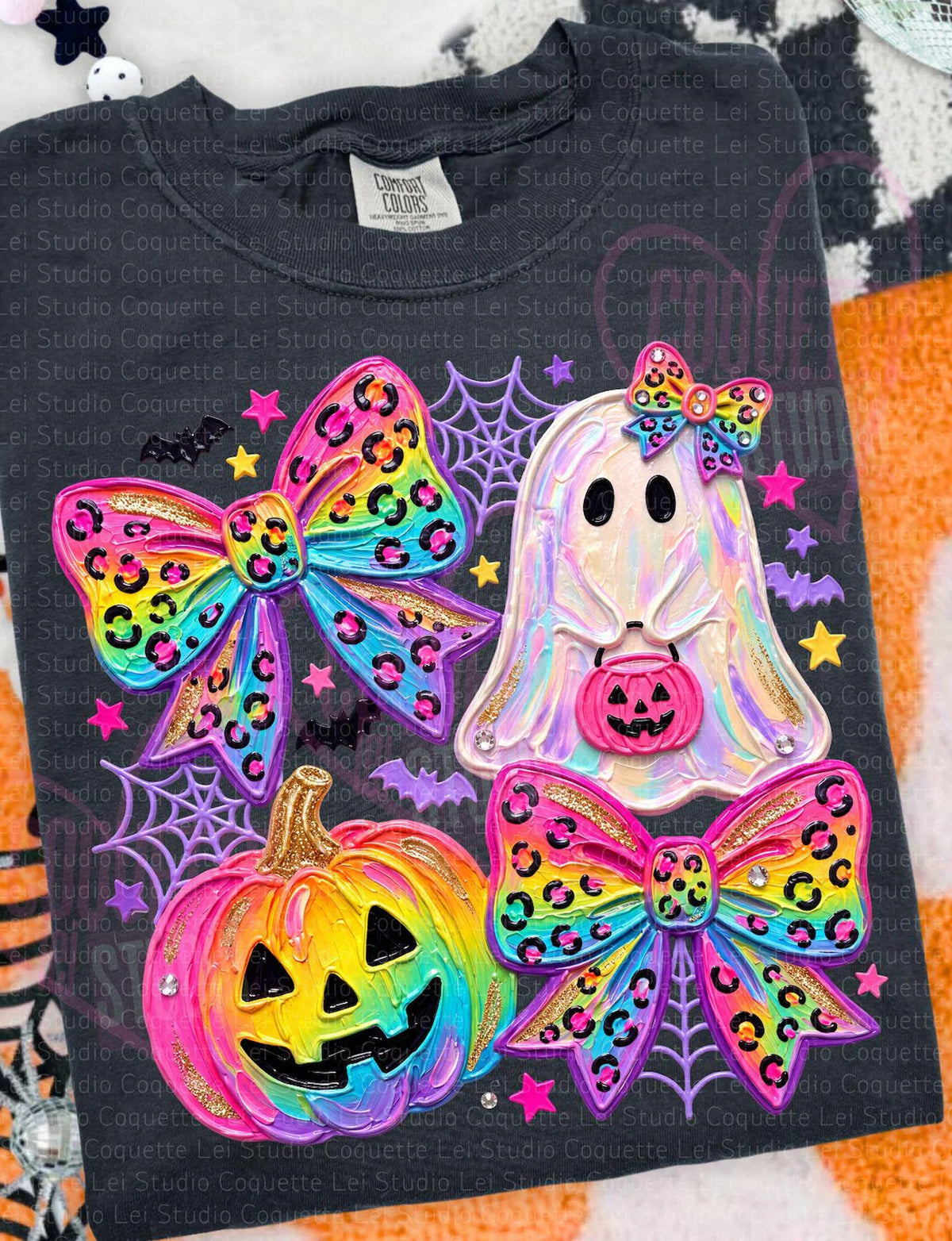 Purple Halloween tee close-up with holographic ghost face, colorful bows, jack-o'-lantern