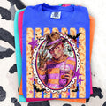 Blue graphic T-shirt with Freddy-style portrait in ornate frame