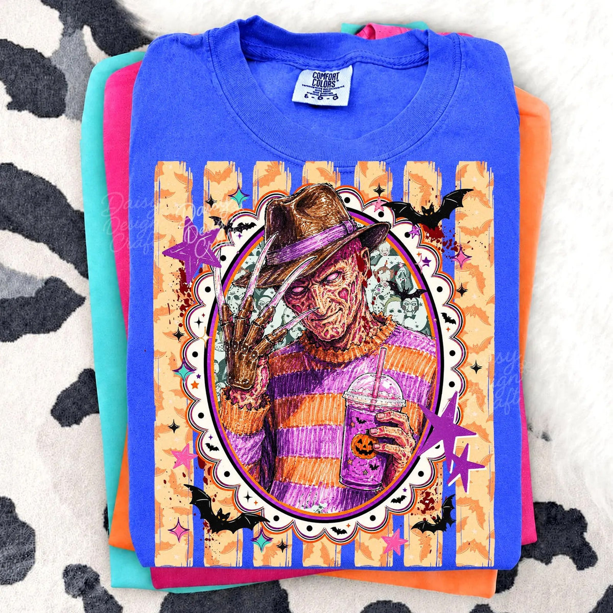 Blue graphic T-shirt with Freddy-style portrait in ornate frame
