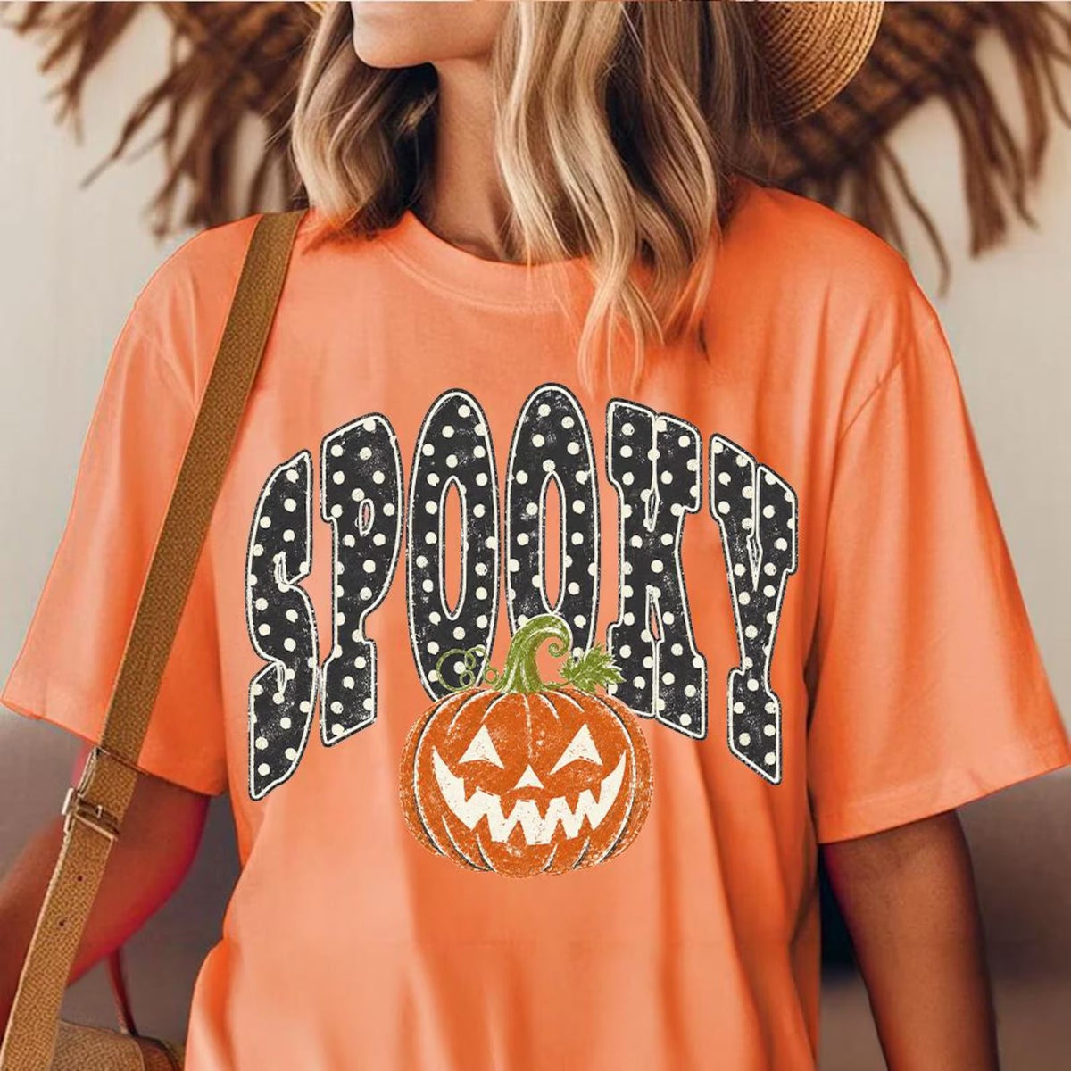 Orange graphic tee with Spooky text and jack-o-lantern pumpkin print