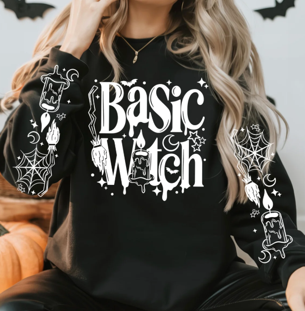 Black long-sleeve crewneck tee with white Basic Witch candle graphic