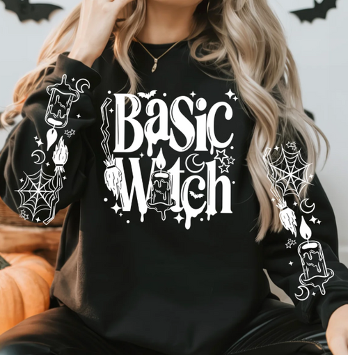 Black long-sleeve crewneck tee with white Basic Witch candle graphic