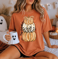 Orange graphic tee with glitter pumpkin front illustration