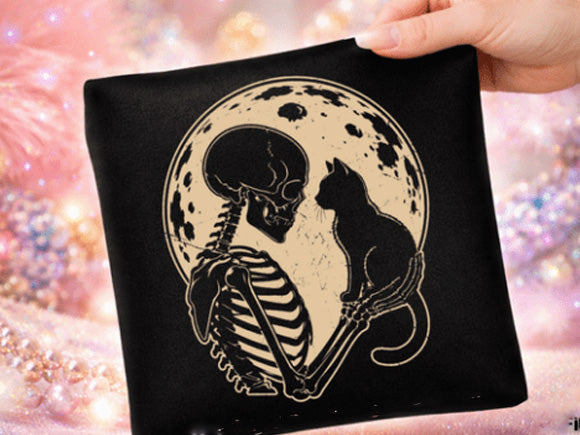 Black graphic tee with cat and skeleton design on the front