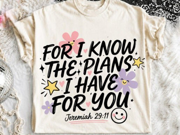 Cream graphic tee with “For I know the plans I have for you” front text and stars