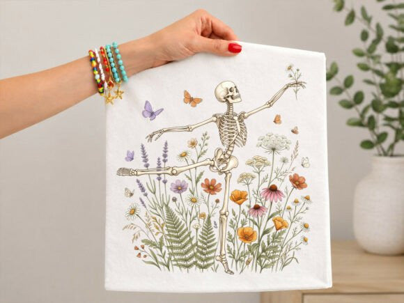 White graphic tee with dancing skeleton and colorful floral butterflies print