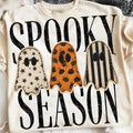 Graphic Halloween tee in cream with three ghost shapes and spooky lettering