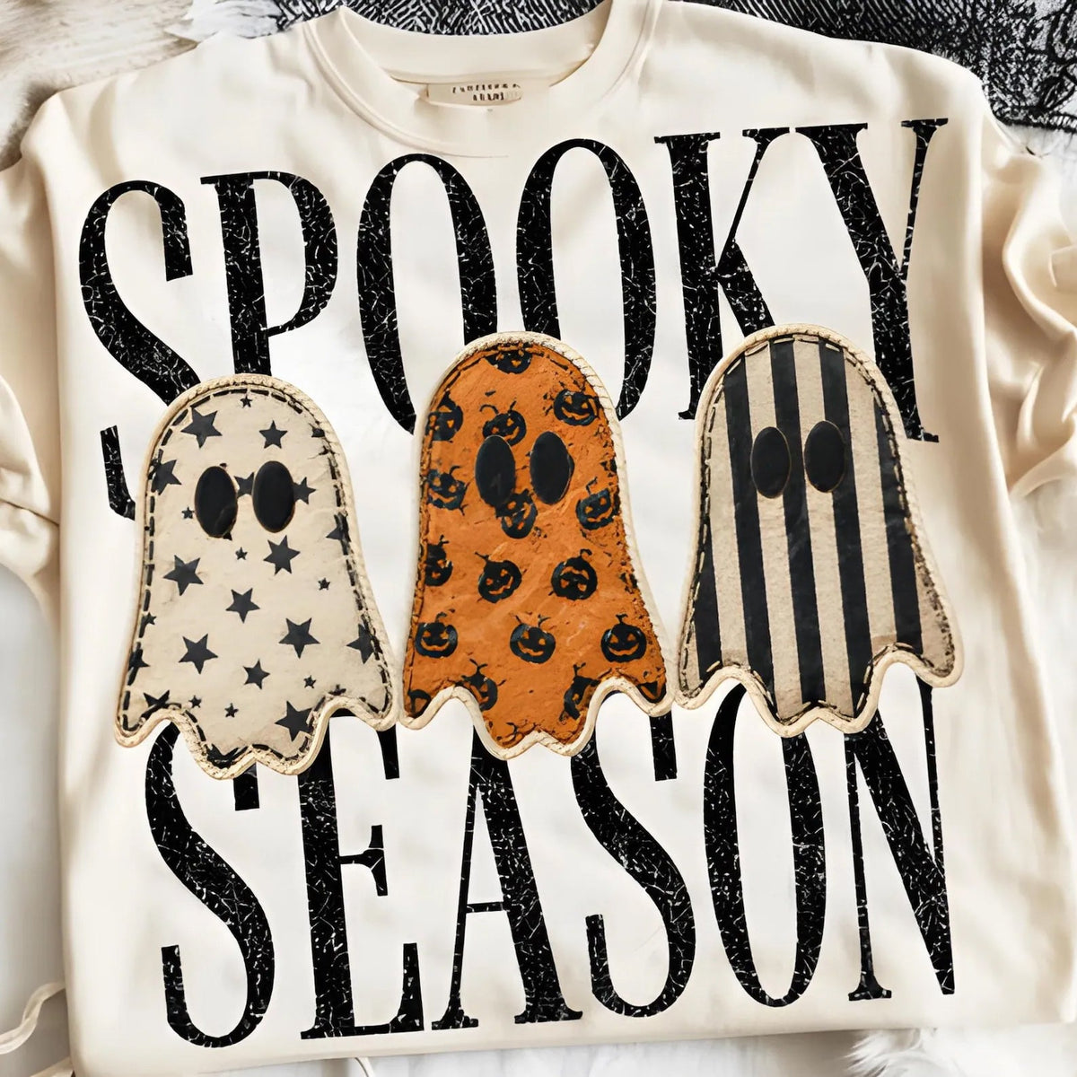 Graphic Halloween tee in cream with three ghost shapes and spooky lettering