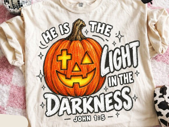 Graphic tee with orange jack-o'-lantern face and Halloween text print, crew neck