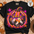 Black graphic tee with rainbow pumpkin and ghost scene, stars and jack-o’-lantern print