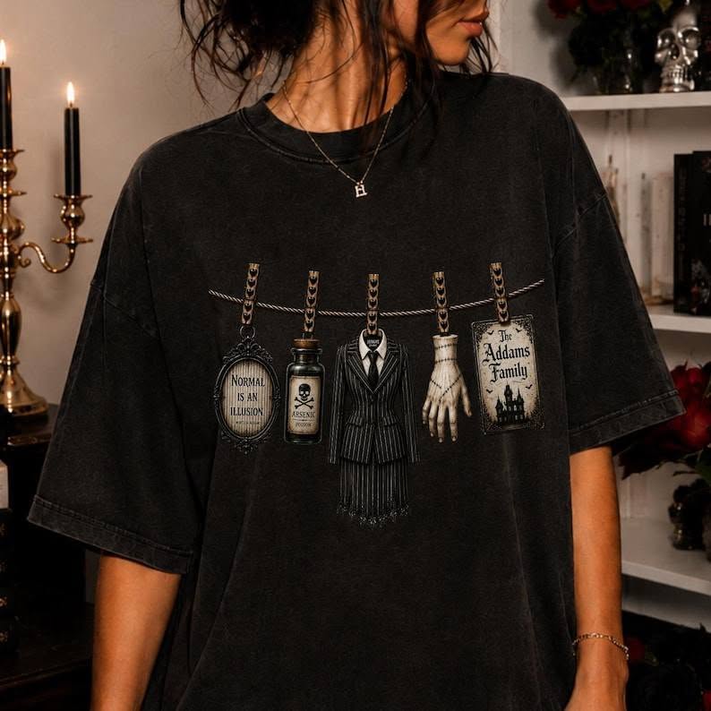Black graphic T-shirt with Addams Family clothesline characters print