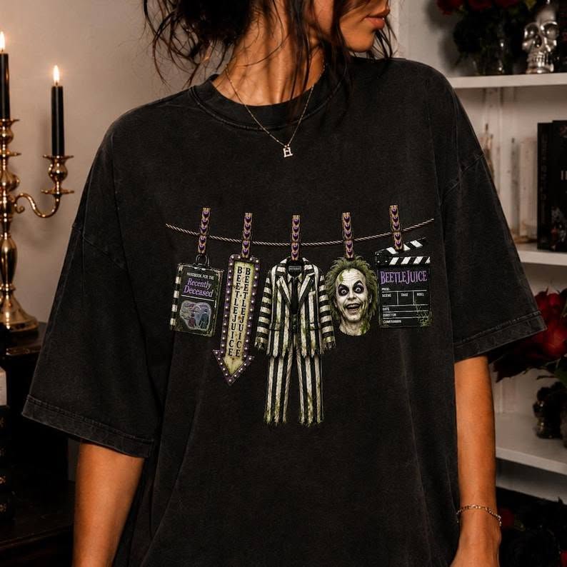 Black Beetlejuice graphic tee with clothesline hanging tags and face print