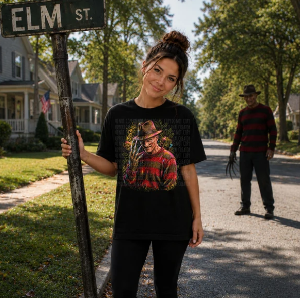 Black crewneck tee with large leopard graphic of hat-wearing figure on front