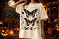 Cream graphic T-shirt with dark butterfly print