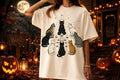 Cream graphic tee with witch cats and star accents, short sleeves
