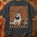 Dark charcoal graphic tee with front ghost character and Ghosting Everyone text