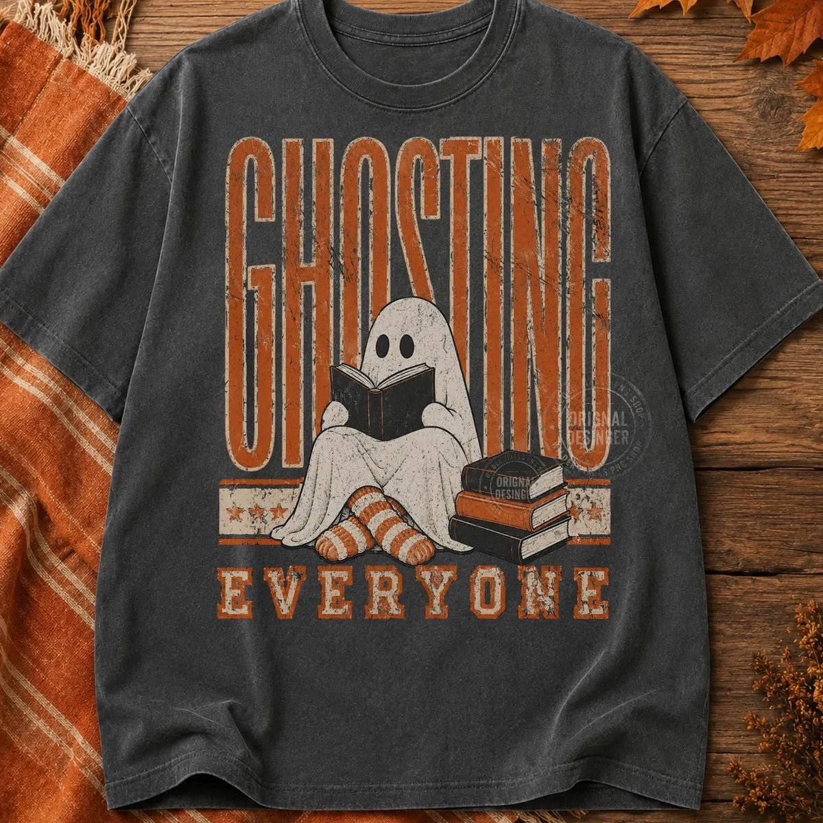 Dark charcoal graphic tee with front ghost character and Ghosting Everyone text