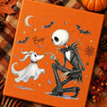 Orange graphic T-shirt with Halloween ghost, bats, moon, and jack-o-lantern face