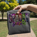 Dark gray graphic tee with “Spooky Season” horror faces and purple lettering