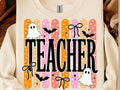 Light graphic Halloween teacher T-shirt with vertical stripe pattern and ghost/bat art
