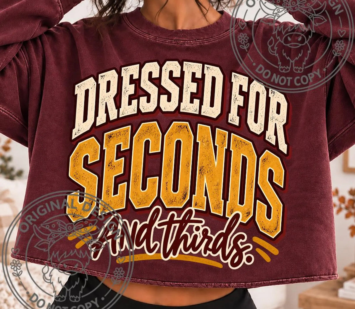 Maroon graphic tee with bold front text and layered "Dressed for Seconds" design