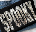Black graphic tee with mirrored disco ball-style letter print on the front