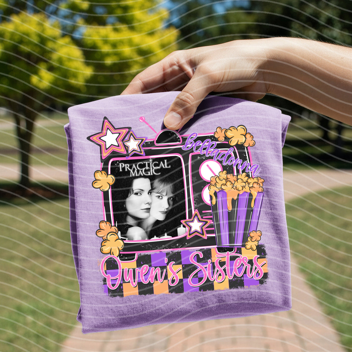 Lavender graphic tee with framed star design, portrait, and 'Queens Sisters' text