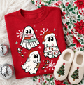 Red graphic tee with three reading ghosts wearing winter hats and scarves