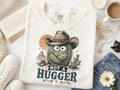 White Comfort Colors graphic tee with cactus cartoon and "Not a Hugger" print