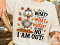 White graphic T-shirt with cartoon bird, autumn leaves, and 'I AM OUT!' text