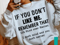 White crewneck graphic sweatshirt with bold “IF YOU DON’T LIKE ME” text