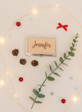 Engraved card holder with “Jennifer” script in a silver frame and easel stand