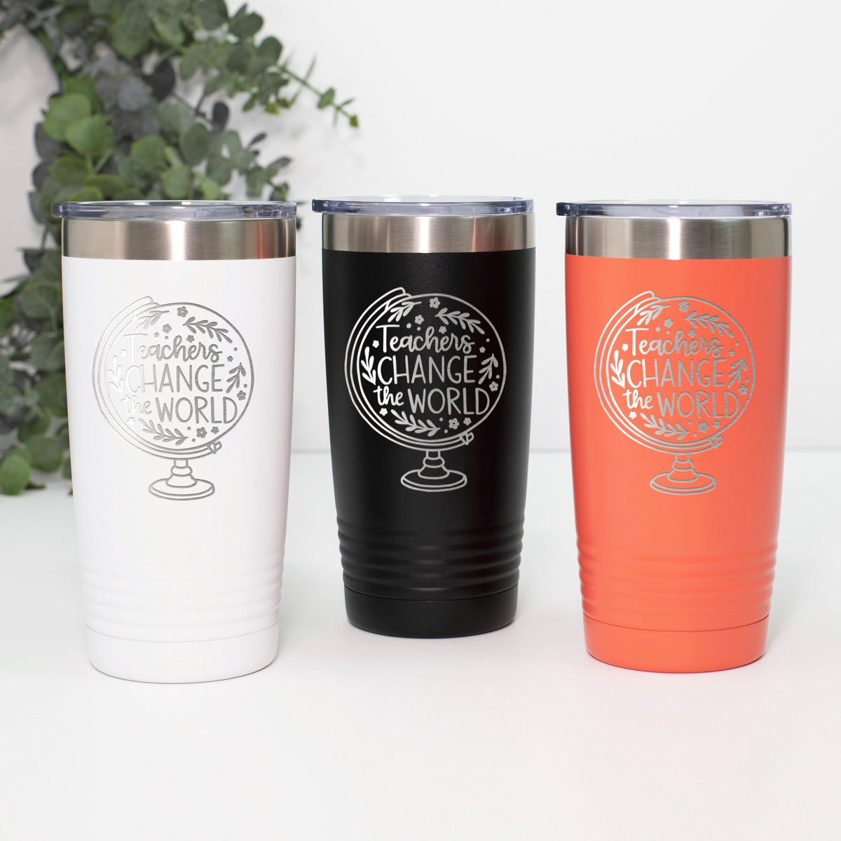Set of three insulated travel tumblers: white, black, and orange with Teachers Change logo